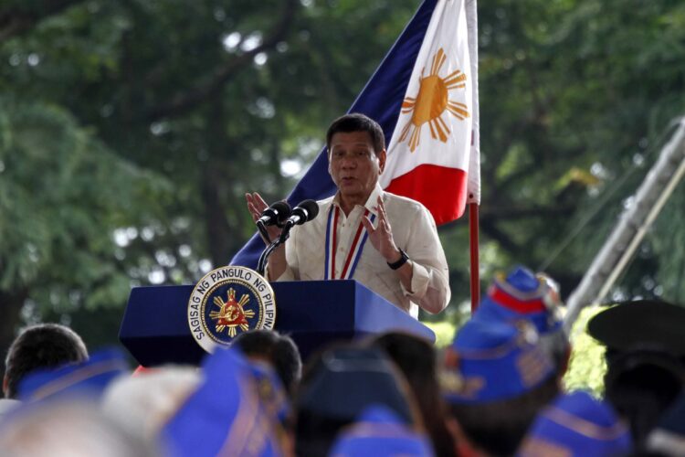 President Rodrigo R. Duterte gestures with both hands to stress a point in his speech during the National Heroes' Day observance at the Libingan ng mga Bayani in Fort Bonifacio, Taguig City on Monday (Aug. 29, 2016). The President announced the release of PHP4.7 billion in unpaid total administrative disability for widows of World War II veterans and Armed Forces of the Philippines (AFP) retirees. Reading from the notes handed to him by Budget Secretary Benjamin Diokno, the President said the spouses of deceased WWII veterans aged 80 and above will get a total of PHP3.5 billion. On the other hand, AFP retirees will receive PHP1.2 billion. (PNA photo by Avito C. Dalan)