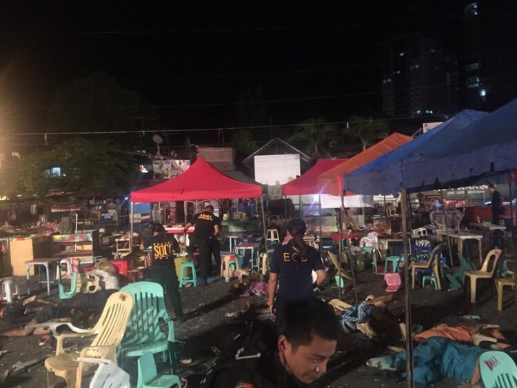 Teams from the Scene of the Crime Operatives (SOCO) and the Explosives and Ordnance Division (EOD) of the Philippine National Police in Davao scour the blast site where an explosion ripped through a crowded night market along Roxas Avenue in Davao City around 10:00 p.m. on Friday (Sept. 2, 2016). (PNA photo courtesy of Ayan Mellejor)