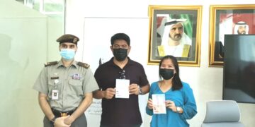 Lt. Abubaker Ahmed Al Ali of the General Directorate of Residency and Foreigners Affairs together with John Paul and Nancy Faderogao. (Filipino Times)