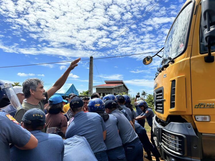 Sibuyan residents block mining truck pushing through barricades